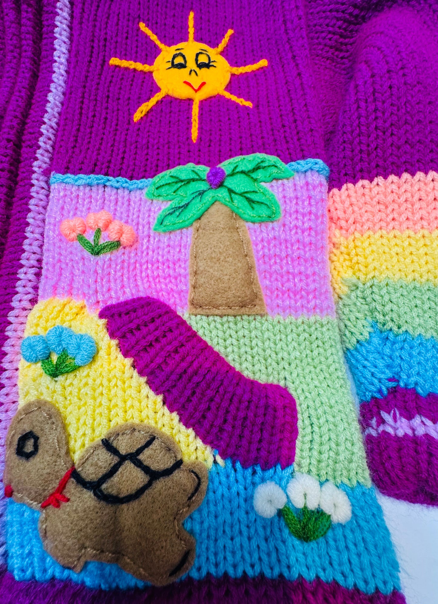Children's sweater with a landscape design