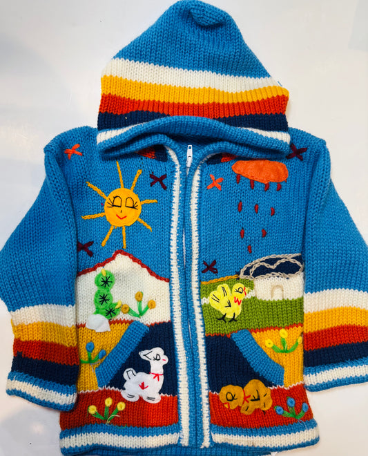 Children's sweater with a landscape design